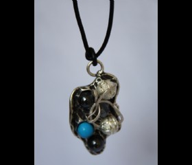 Silver cast with turquoise for the neck
