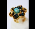 Round golden ring with turquoise central pearl