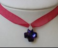 Purple swarowsky cross with fuchsia ribbon